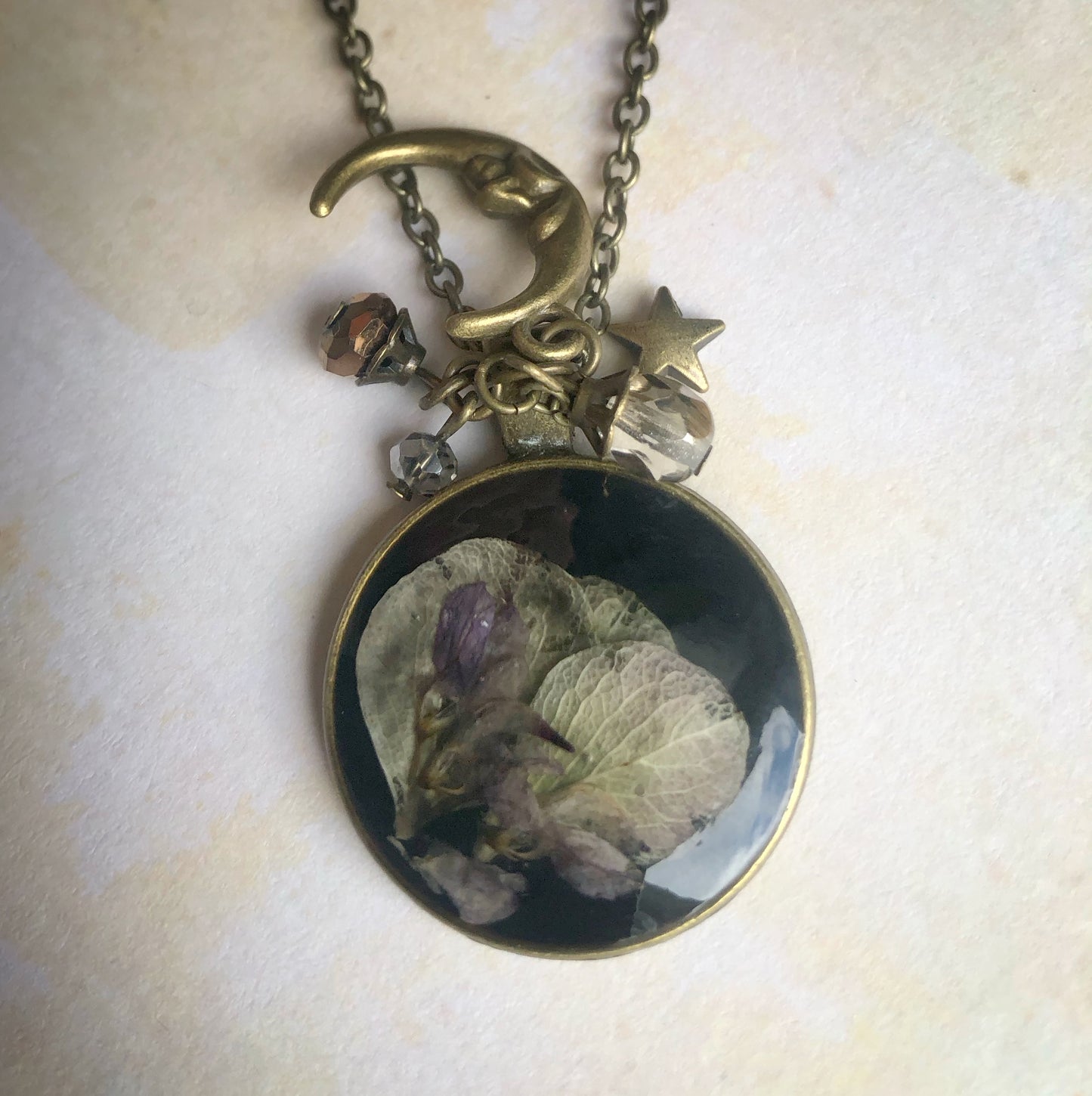 Fallen Petals in the Pond with Brass Moon and Stars Charms