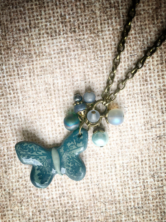 Clay Butterfly with bead cluster on 30” long chain