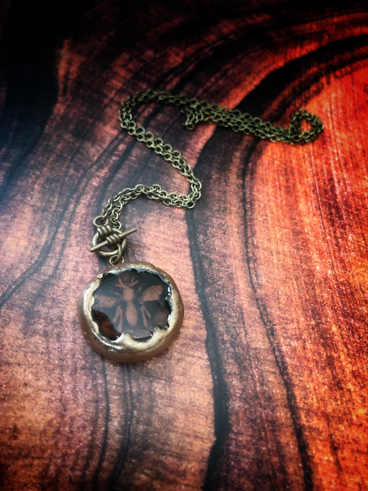 Hand Carved Clay Bee Encased in a Resin Seal Enhanced with Antique Gold