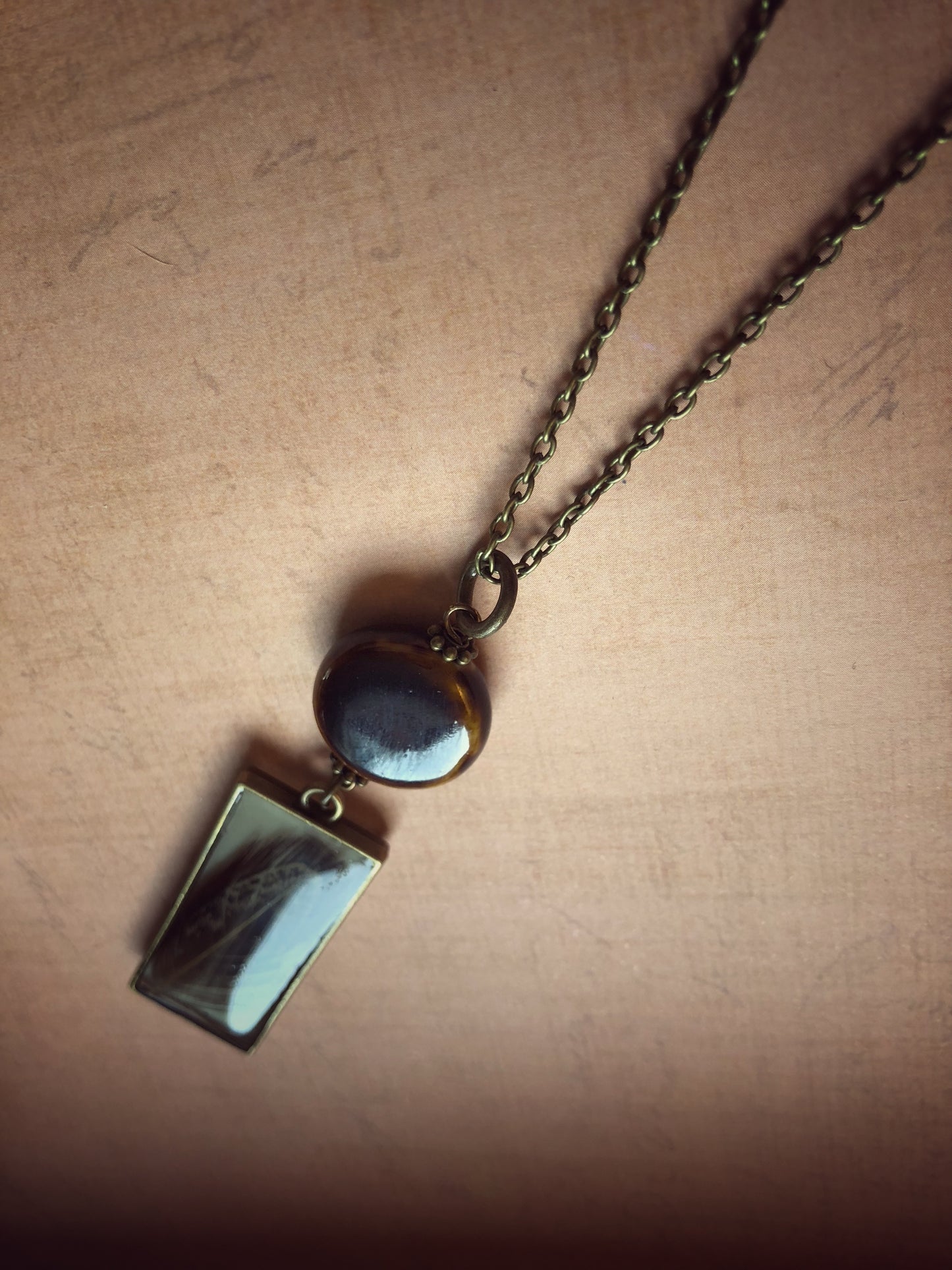 Long Necklace Brown Feather in Resin with Ceramic Bead on Antiqued Brass Chain