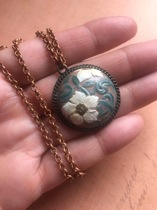 Hand Painted Floral Design on Hand Made Clay Cabochon set in a 1” Round Antiqued Copper