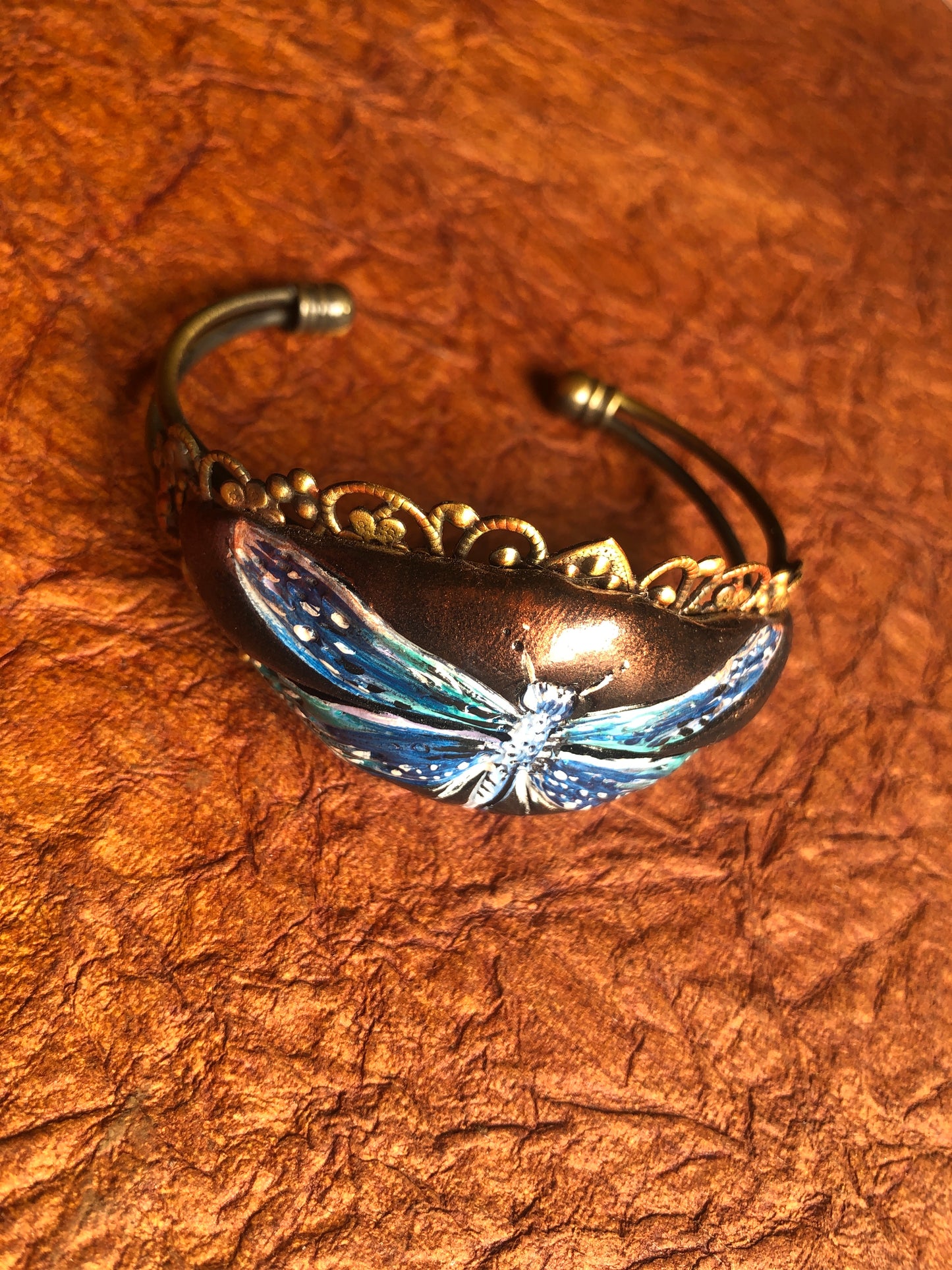 Hand Painted Dragonfly in Black Clay set on an Antiqued Brass Filigree Cuff Bracelet