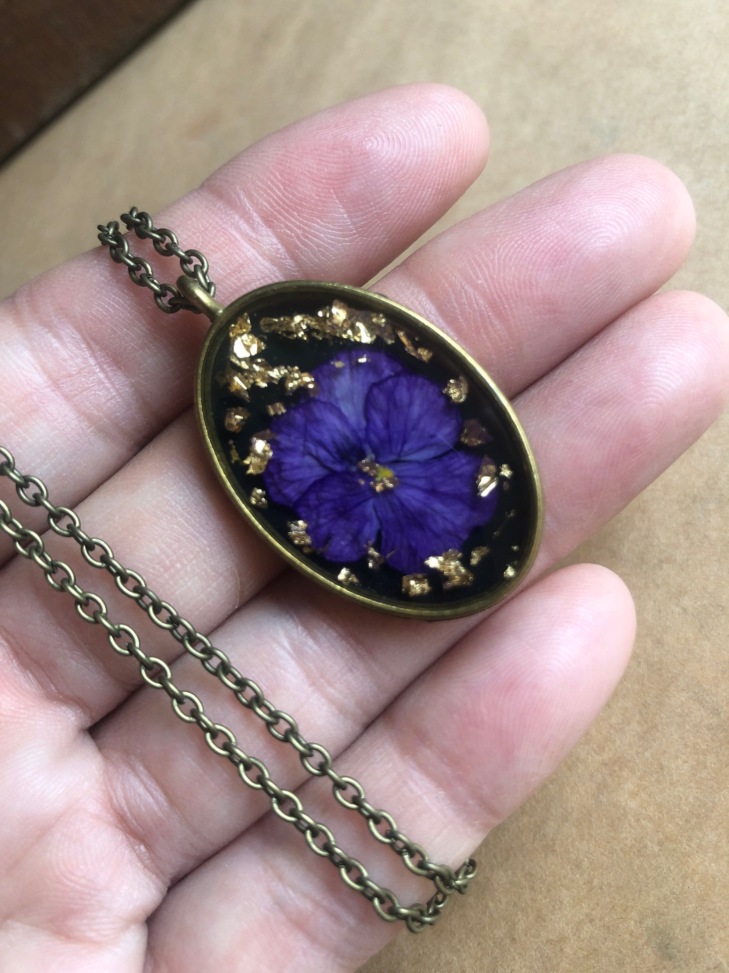 Purple Pansy on Black in Resin w Gold Flecks set in Brass