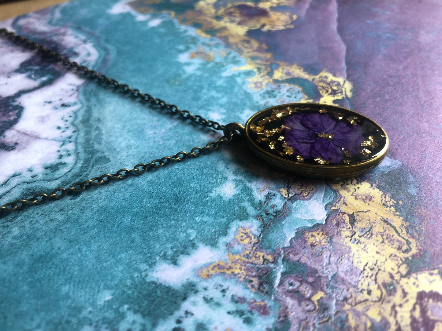 Purple Pansy on Black in Resin w Gold Flecks set in Brass