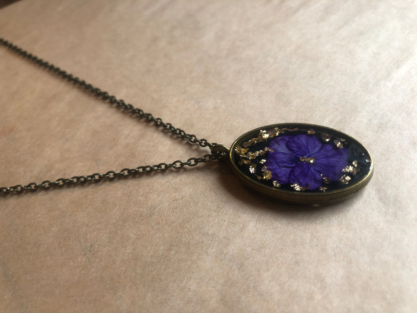 Purple Pansy on Black in Resin w Gold Flecks set in Brass